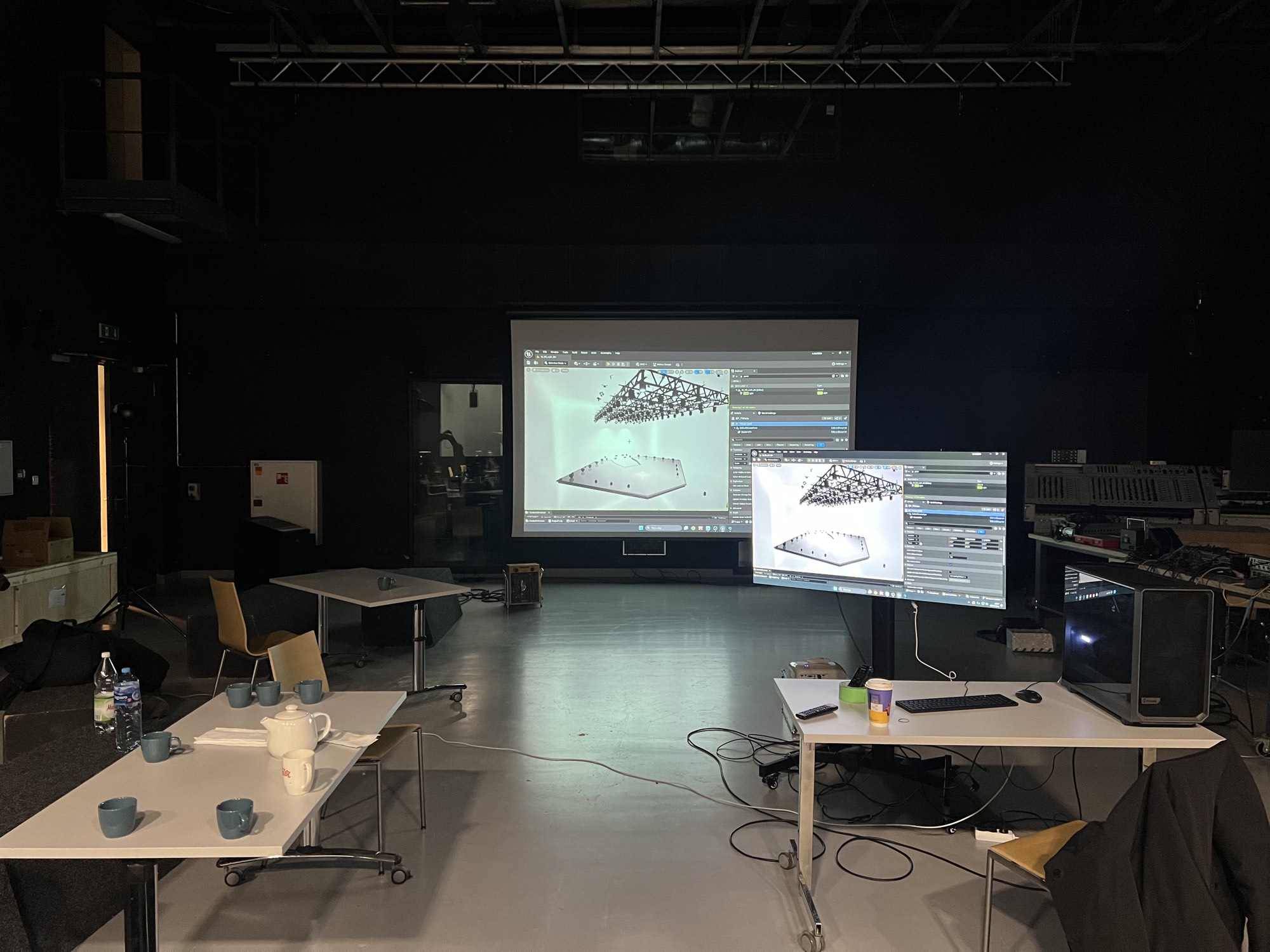Workshop station: Unreal Engine on the projector and a second screen, showing a stage rig being built