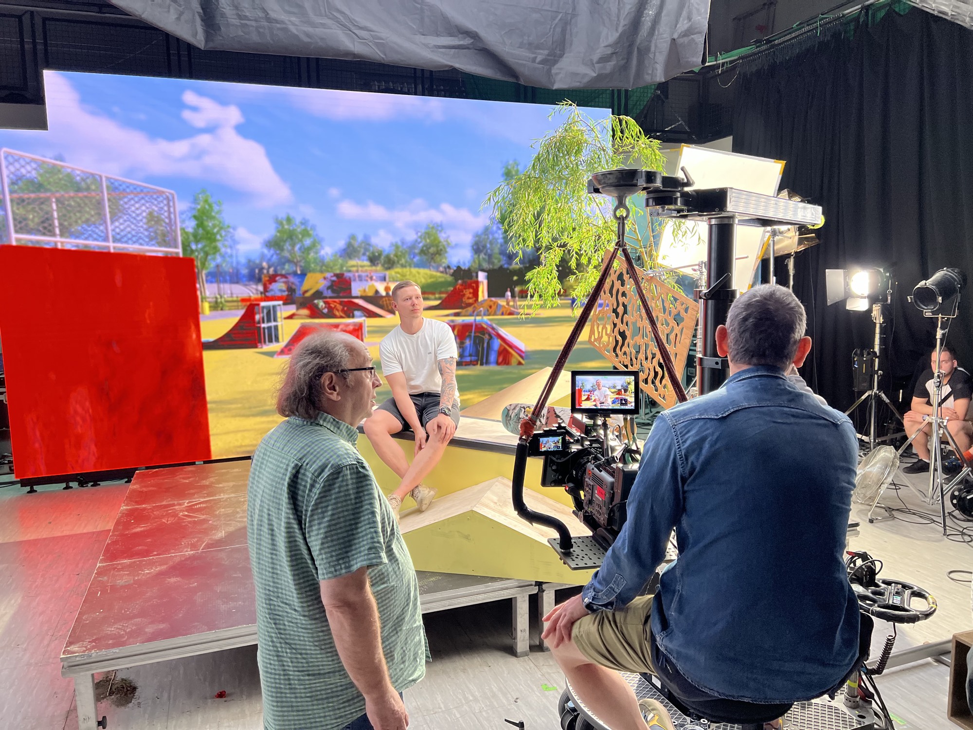 Director and DP working with talent on the skatepark set