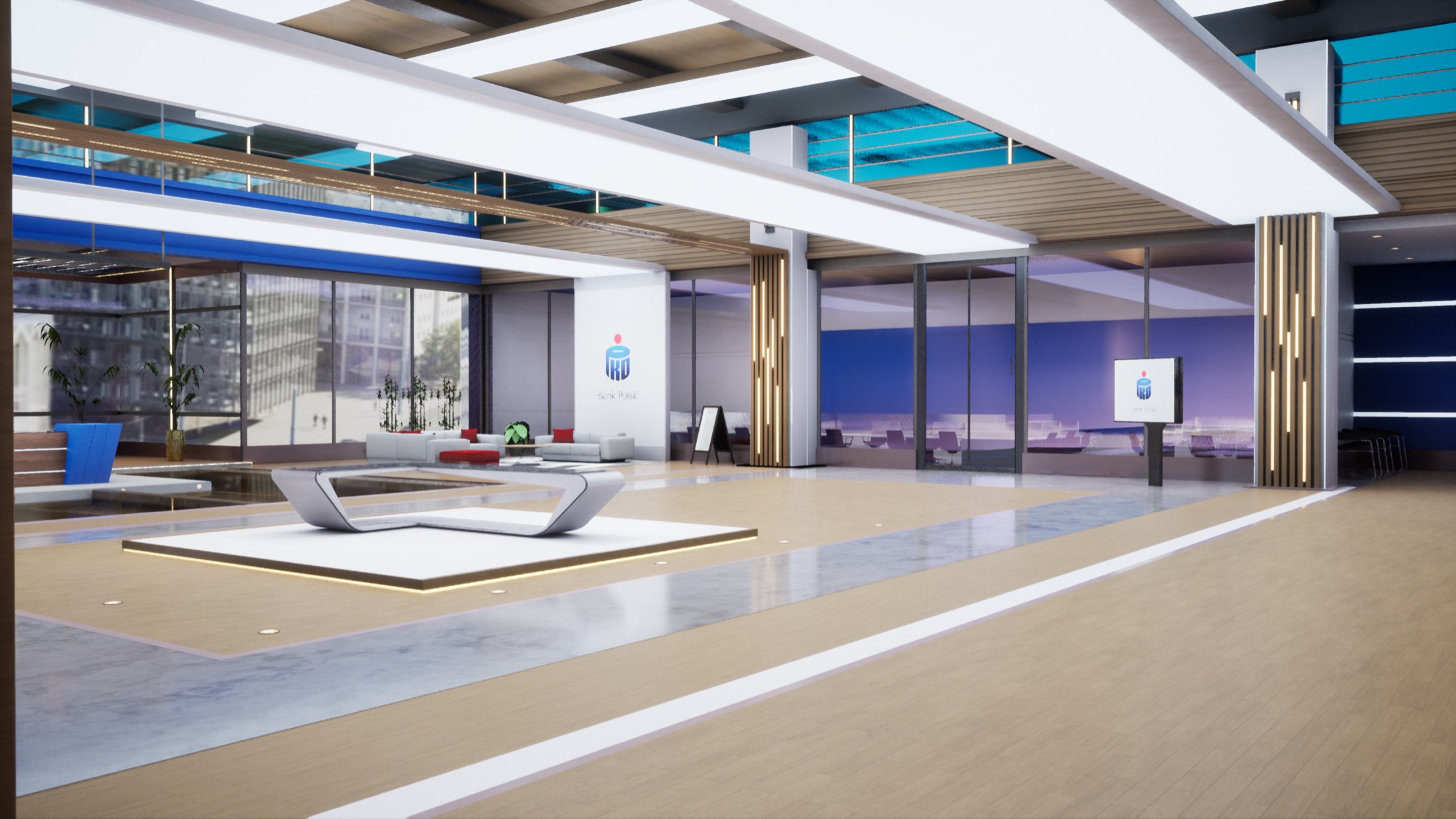 Wide angle across the studio floor towards the seating area and the branded wall